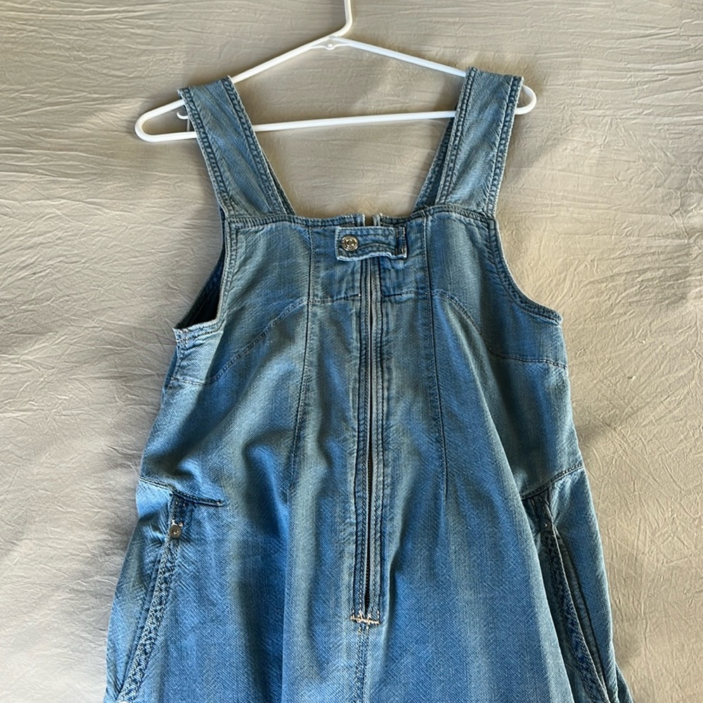 We the free overalls. These are so cute! They are oversized & fit like a small.